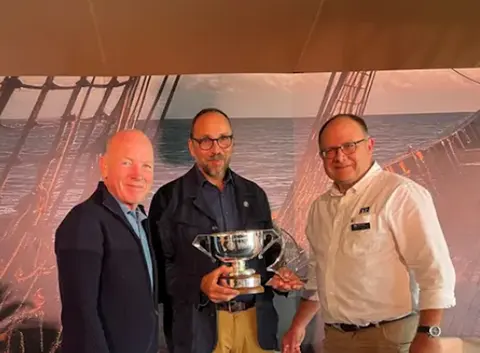 Tom Stierle presented with prestigious award by Mike Golding OBE.png